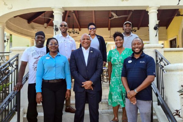 Deputy Prime Minister Dr Ernest Hilaire and SLTA CEO Lorine Charles-St. Jules meet with Saint Lucians working at Beaches Turks and Caicos
