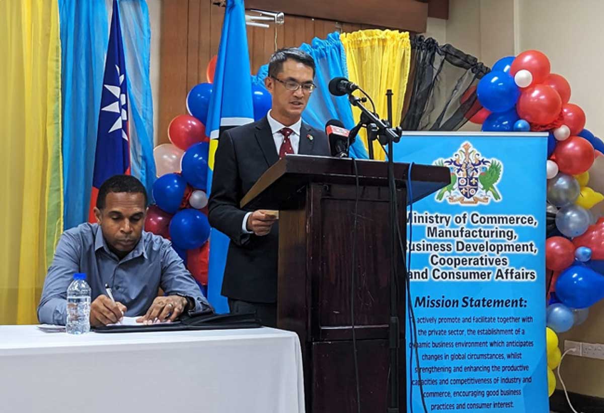 His Excellency Peter Chia-Yen Chen, Taiwan’s Ambassador to Saint Lucia, right, speaking at the opening ceremony of the Community Business Revitalization Project, on Tuesday, August 22, 2023, at the Public Service Training Institute at Union, Castries. At left is Mr. Johnathan Allain, Director of Small Business Development Centre (Ag.) in the Ministry of Commerce, Manufacturing, Business Development, Cooperatives and Consumer Affairs.