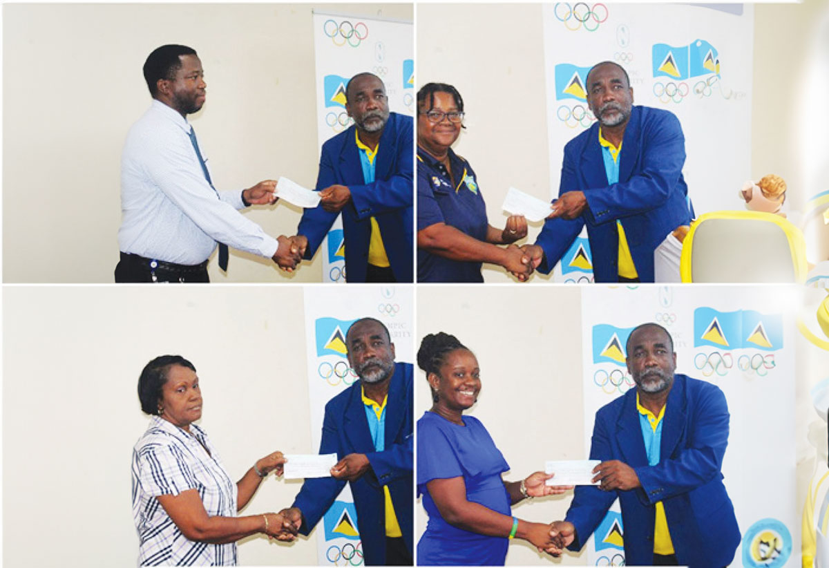 SLOC Inc. President, Alfred Emmanuel, hands over cheques to the various association representatives last Tuesday.
