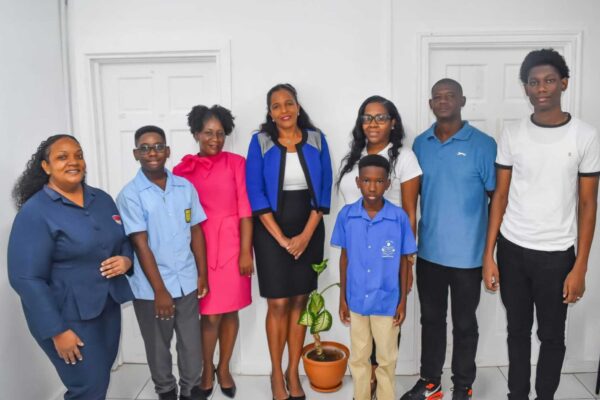 Scholarship recipients and parents, with the GTM Branch Manager, Ms. Germaine Maxwell and Senior Administrative Assistant – GTM Vieux Fort, Ms. Emmalee Emmanuel