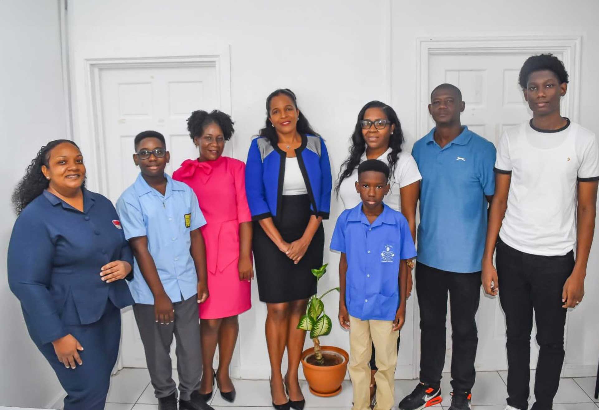 Scholarship recipients and parents, with the GTM Branch Manager, Ms. Germaine Maxwell and Senior Administrative Assistant – GTM Vieux Fort, Ms. Emmalee Emmanuel