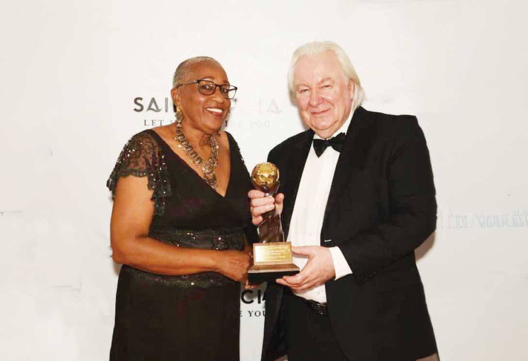 Solar Tours & Travel CEO Carmelita Xavier accepts the prize award