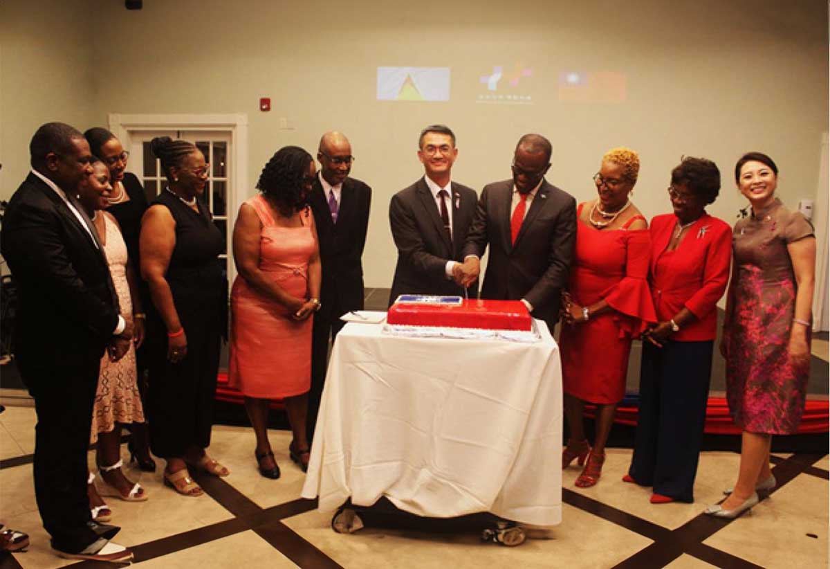 His Excellency Peter Chia-Yen Chen, Taiwan’s Ambassador to Saint Lucia, joins Hon. Philip J. Pierre, Prime Minister, Minister for Finance, Economic Development and the Youth Economy and Minister for Justice and National Security, in cutting the cake to celebrate Taiwan’s 112th National Day at the gala reception held at Sandals Golf & Country Club on Wednesday, October 4, 2023. Also pictured are - from left to right - Hon. Alva Baptiste, Minister for External Affairs, International Trade, Civil Aviation and Diaspora Affairs; Sen. Kaygianna Toussaint Charlery; Sen. Lisa Jawahir; Sen. Dr. Allison Jean; Hon. Virginia Albert-Poyotte, Minister for the Public Service, Home Affairs, Labour and Gender Affairs; Hon. Claudius Francis, Speaker of the House of Assembly; Ms. Marie Felix, spouse of Hon. Pierre; Her Excellency Dame Pearlette Louisy, Governor General Emeritus; and Mrs. Chen.