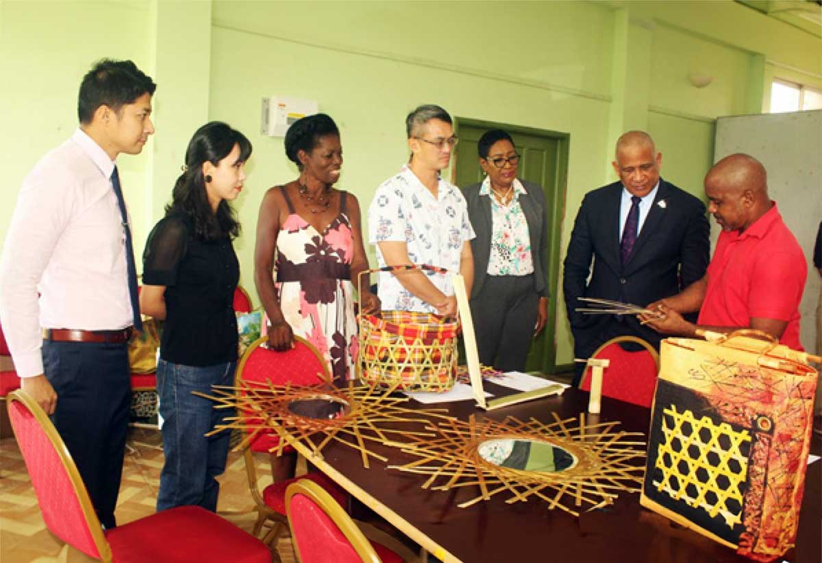 H.E. Peter Chia-Yen Chen, Taiwan’s Ambassador to Saint Lucia; Hon. Dr. Ernest Hilaire, Deputy Prime Minister and Minister for Tourism, Investment, Creative Industries, Culture and Information; Mr. Daniel Lee, Chief of the Taiwan Technical Mission (TTM); Ms. Ya Ching Lee, workshop facilitator; and Mrs. Raymona Henry-Wynne, Executive Director of CDF; engaging two workshop participants (third from left and far right) during last Tuesday morning’s visit. 